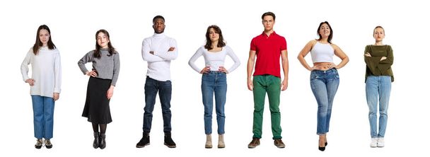 Set of young happy, multi ethnic people, men and women standing isolated over white background, Horizontal flyer, banner. Models in casual clothes - Valokuva, kuva