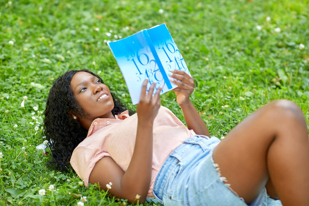african student girl reading math textbook - Valokuva, kuva