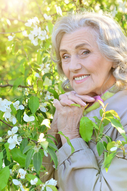 happy smiling senior woman  posing  in park outdoors  - Photo, image