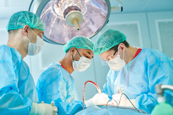 Emergency surgery. Surgeons during surgical intervention in clinic - Valokuva, kuva