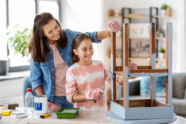 mother and daughter painting old table in grey - Photo, Image