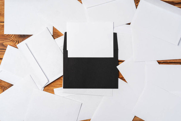 Stack of envelopes on working desk top view. Business mail - Fotó, kép