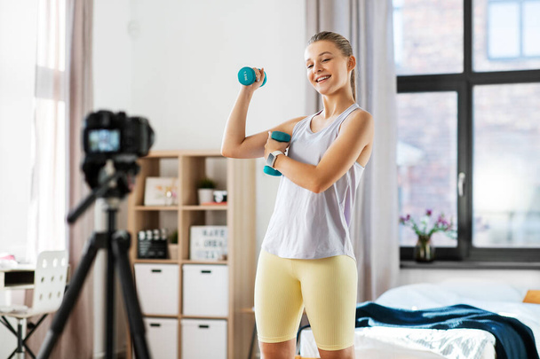 teenage girl or blogger recording gym class video - Фото, изображение