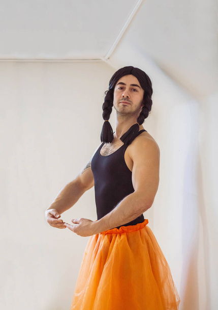 Young muscular man pretending to be a ballerina - Фото, зображення