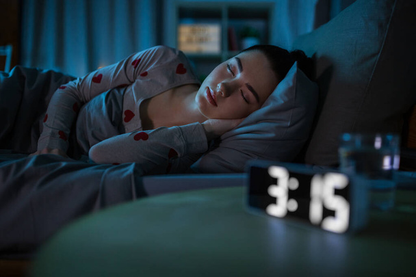 teenage girl sleeping at home at night - Photo, image