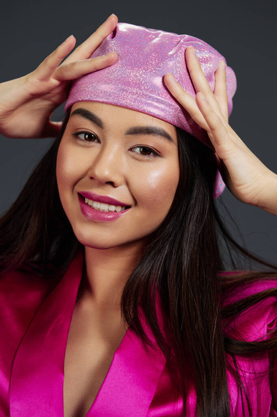 Brunette posing pink mini dress charm headscarf isolated background. High quality photo - Photo, Image