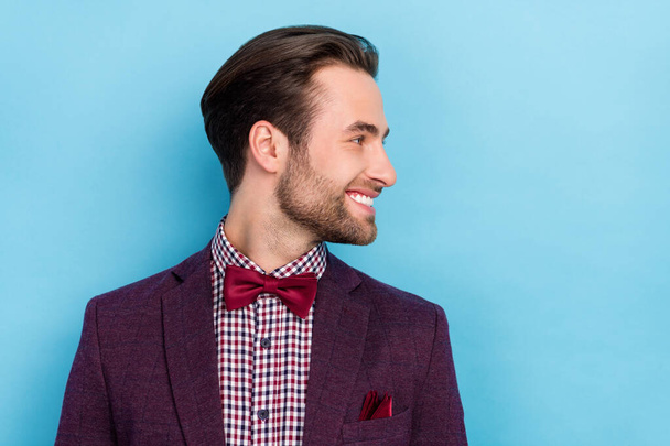 Profile side photo of handsome smiling male look empty space visit barber prepare go on date isolated on blue color background. - Фото, зображення