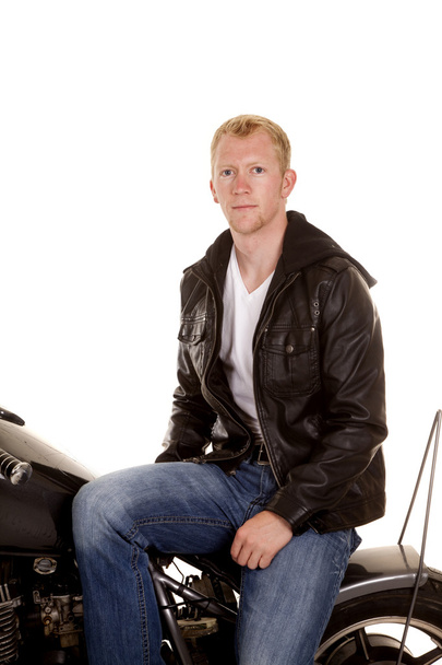 man in black jacket motorcycle sit sideways - Foto, Imagem