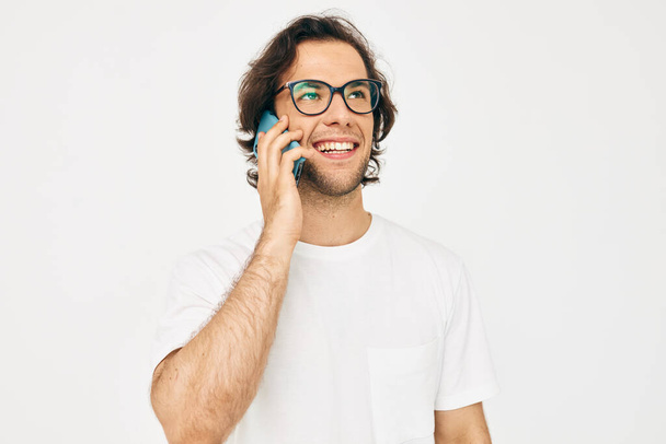 Cheerful man talking on the phone technologies isolated background - Valokuva, kuva