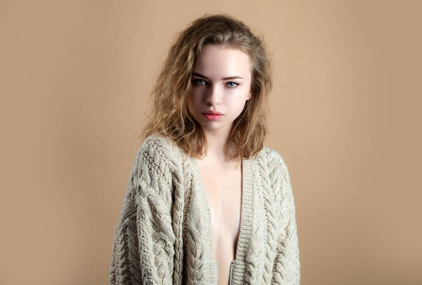 Sexy woman in warm sweater. Cozy fashion. Girl in knitted clothes - 写真・画像
