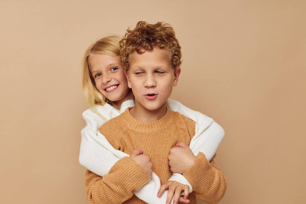 Portrait of cute children hug entertainment posing friendship isolated background - Foto, imagen