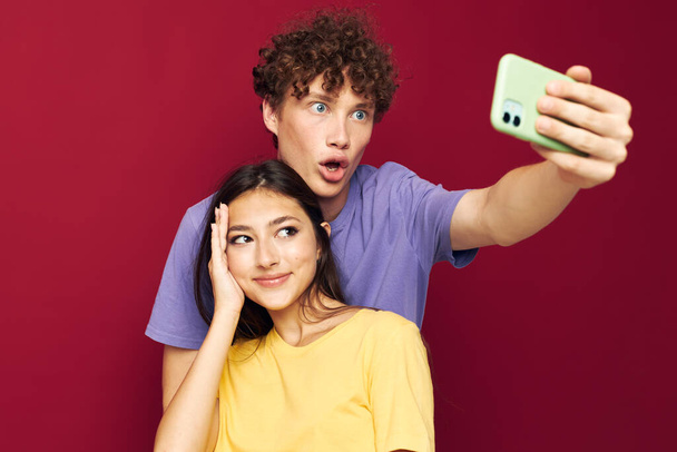 nice guy and girl take a selfie posing hug Youth style - Valokuva, kuva