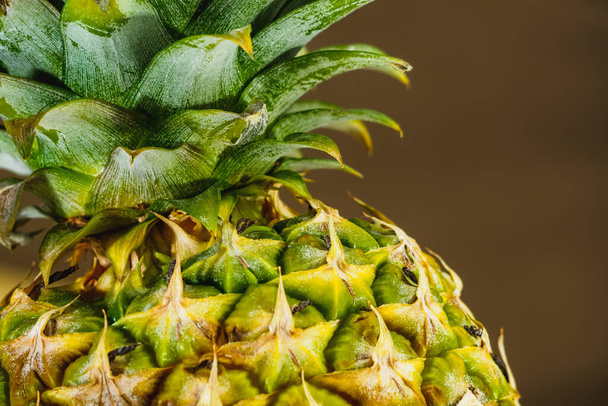 fresh ripe pineapple close up shot with blurred background - Foto, afbeelding