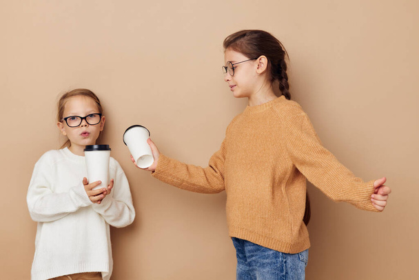 funny little girls with glasses with a drink - Photo, Image