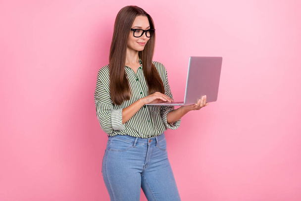 Photo of boss millennial brunette lady type laptop wear eyewear shirt jeans isolated on pink color background - Photo, Image