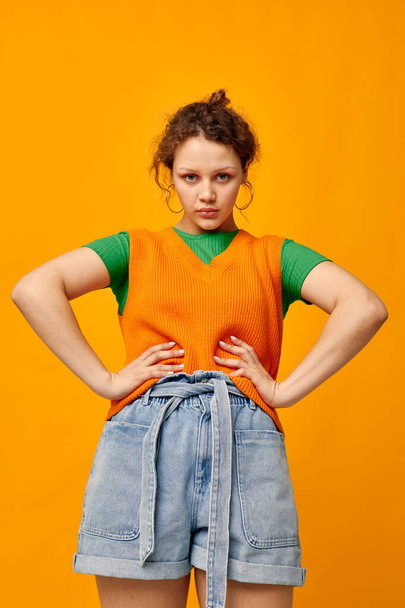 woman in orange sweater fashion Youth Style Studio - Fotó, kép