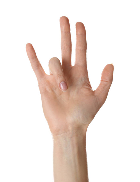 Woman with trigger finger condition on white background, closeup - 写真・画像