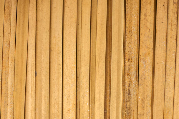Mooie bruine horizontale bamboe mat textuur achtergrond - Foto, afbeelding
