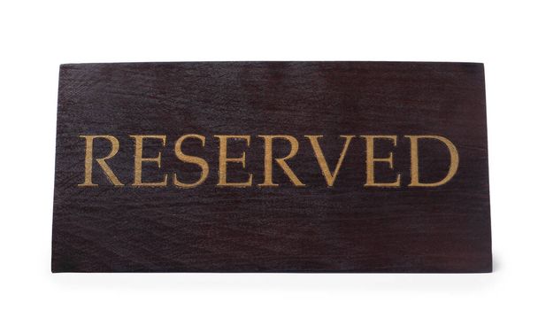 Elegant wooden Reserved table sign isolated on white - Foto, Bild