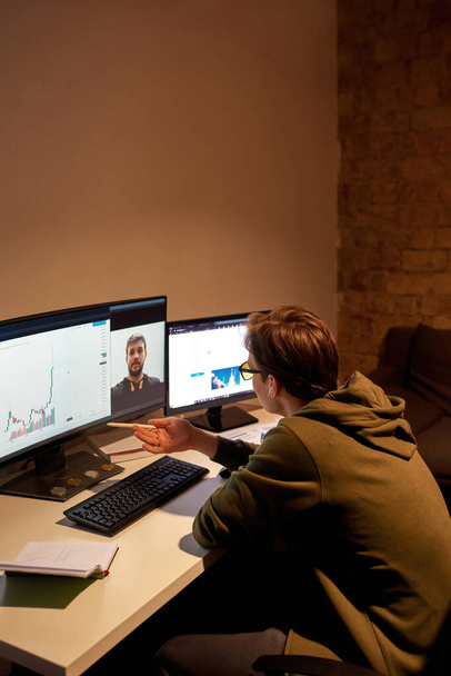 Male trader speak with colleague during video call - Photo, Image