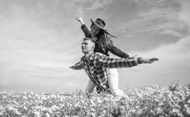 People in wild nature landscape in chamomile horizontal background, fun and happiness - Fotó, kép