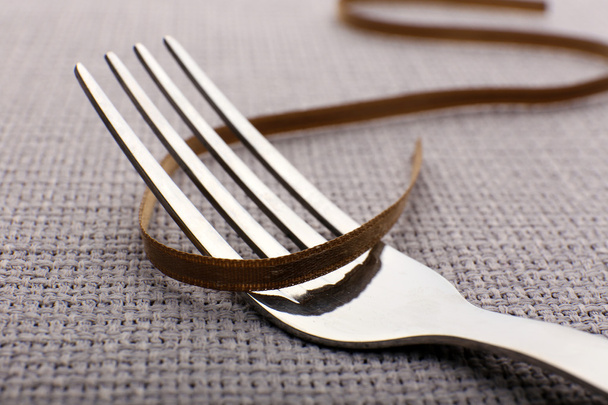 Tying bow on fork - Foto, Bild