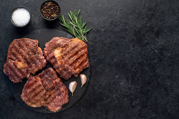 top view of grilled beef steaks with ingredients   - Photo, Image