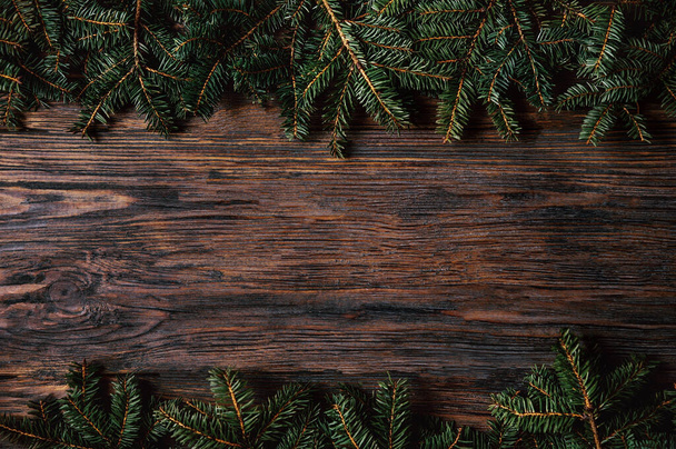 Christmas wooden rustic background with fir tree. - Zdjęcie, obraz