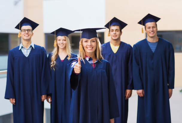 group of smiling students in mortarboards - Foto, Imagen