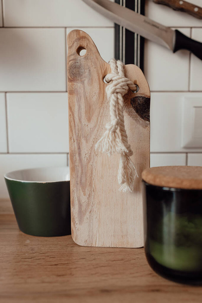 A cute rustic wooden toy in the kitchen. Kitchenware. Cozy way to rest, home comfort concept.  - Fotó, kép