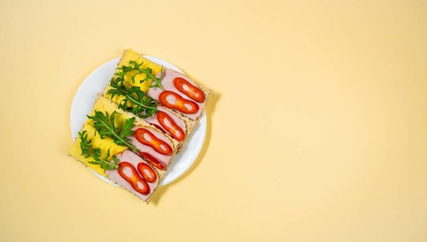 Four rectangular sandwiches with cheese and ha - Photo, Image