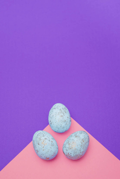 Easter eggs on a colored background. Festive banner with copy space. Vertical Format - 写真・画像