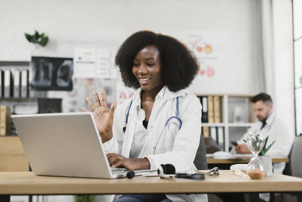 African female doctor having video call with patient - Fotoğraf, Görsel