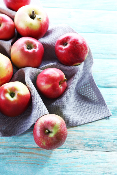 Juicy apples on wooden table, close-up - Fotó, kép