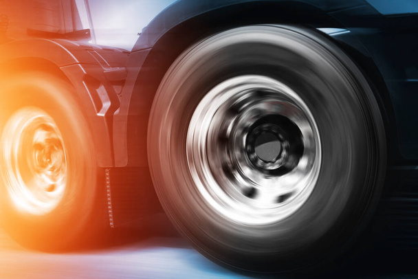 Speed Motion of Semi Truck Wheels Spinning. Truck Driving on The Road. A Big Truck Wheels Tires. - Photo, Image