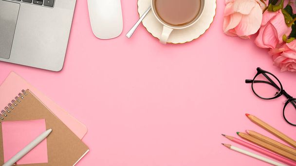 Copy space in beautiful feminine workspace compositions surrounded with female office supplies and accessories on pink background. top view - 写真・画像