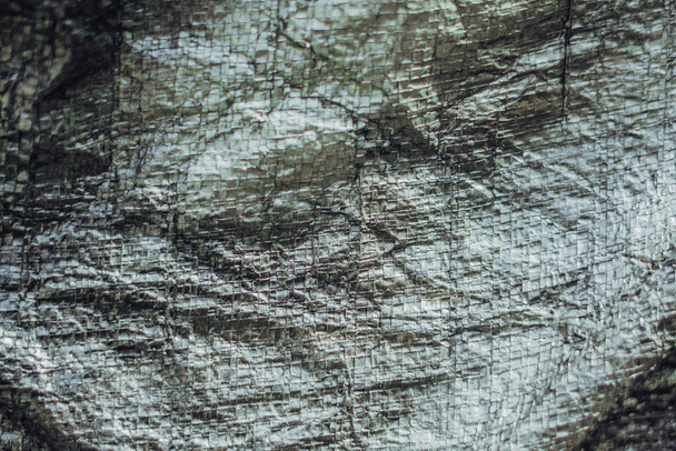 Abstract real fabric surface background. Aluminum Platinum Silver foil Tarpaulin effect with rough texture burlap edge. Futurism 80s retro style new year. Dark Grey black tone design. More in stock  - Φωτογραφία, εικόνα