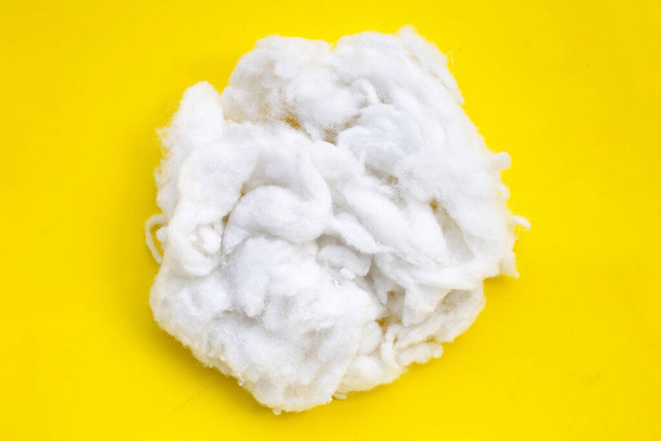 Polyester stable fiber on yellow  background. - Photo, Image