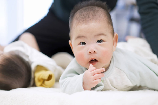 Baby Asian boy turning over - Photo, Image