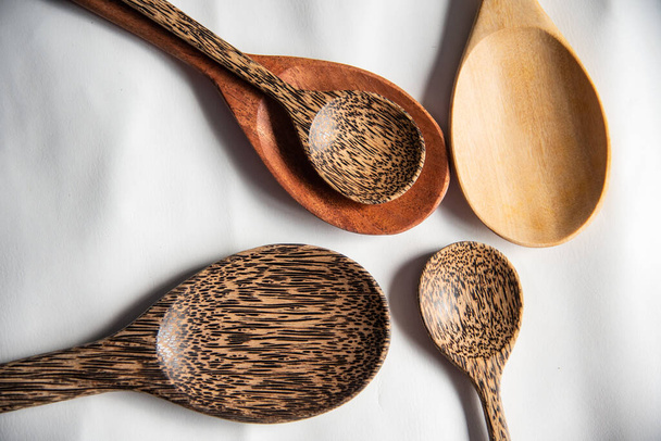 Close up spoon wood on dark background. - Foto, afbeelding