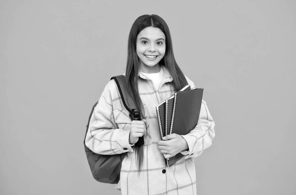 Back to class. cheerful student hold notebooks and books. back to school. teen girl in shirt. - Photo, Image