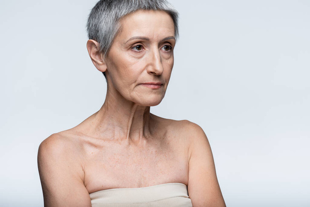 middle aged woman looking away isolated on grey - Photo, Image