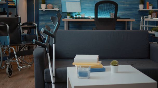 Nobody in living room with medical crutches on couch - Photo, Image