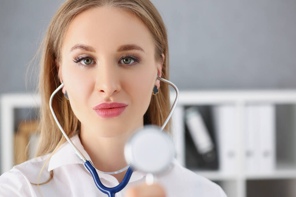 Beautiful young female medical doctor with a stethoscope - Foto, Imagen