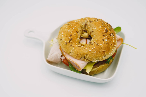 Ham bagel with lettuce and tomato - Photo, Image