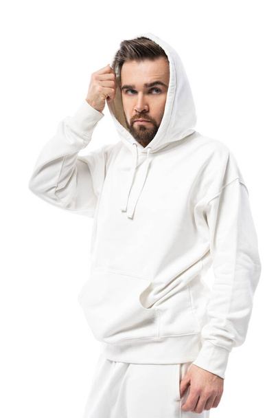 Handsome man wearing blank white hoodie isolated on white background - Fotografie, Obrázek