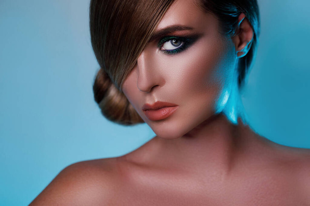 Sexy model in stylish image with sleek hair covering one eye and beautiful green eyeshadows on another - 写真・画像