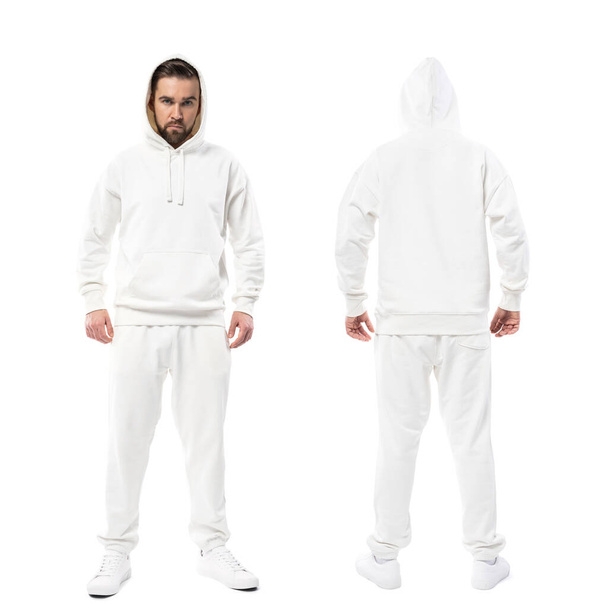 Handsome man wearing blank white hoodie and pants isolated on white background - Foto, afbeelding