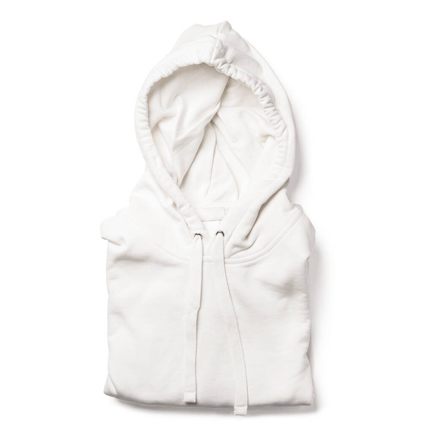 Partially folded white hoodie isolated on white background - 写真・画像