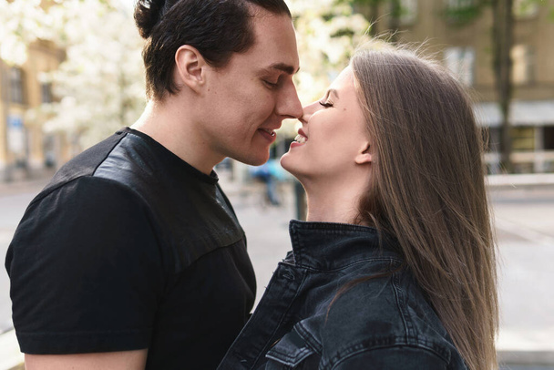 Portrait of young sensual and loving couple during a date outdoors - 写真・画像